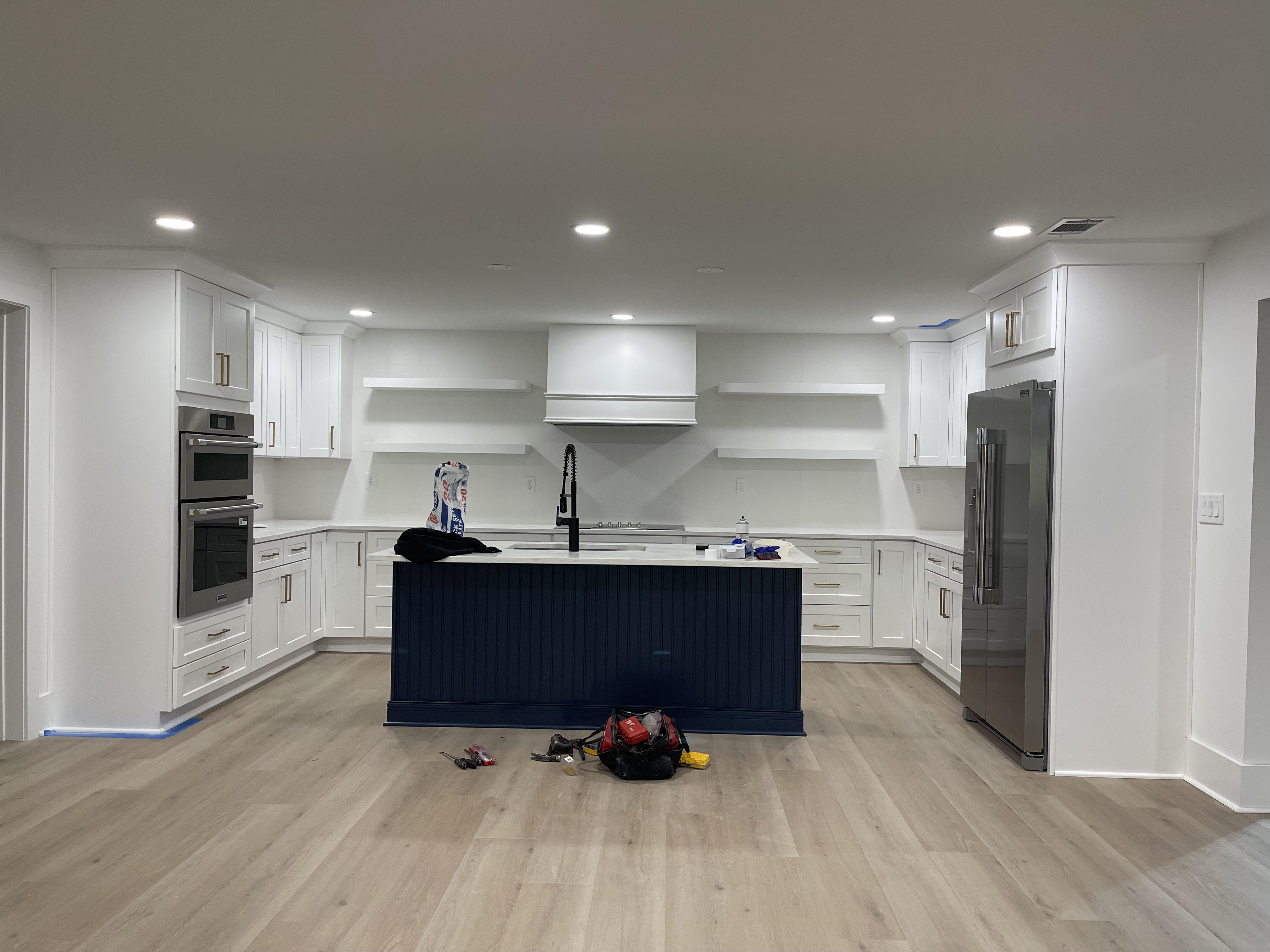 Woodstock basement remodel - kitchen with navy island