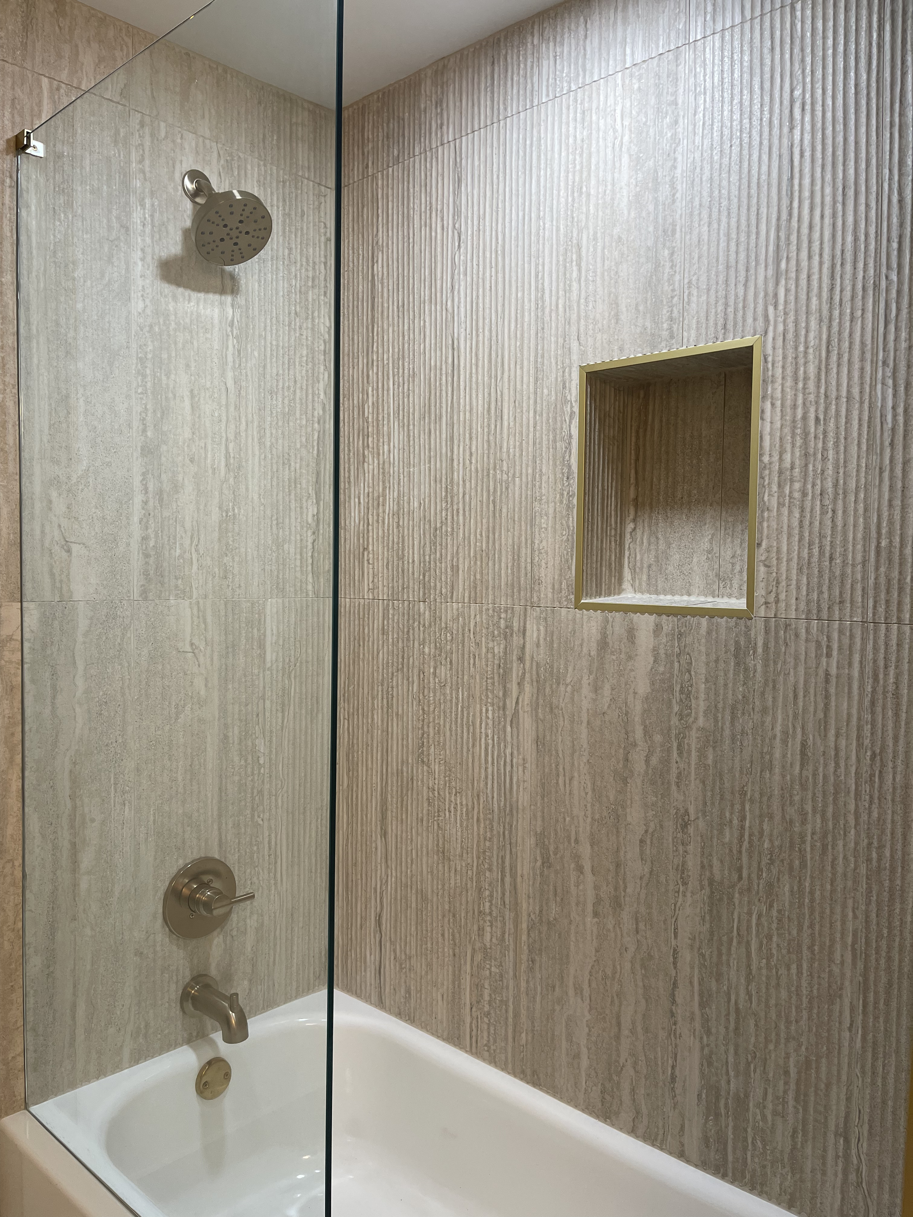 Woodstock basement remodel - bathtub with textured tile